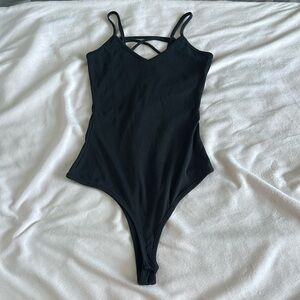 Black cross back Fashionnova body suit